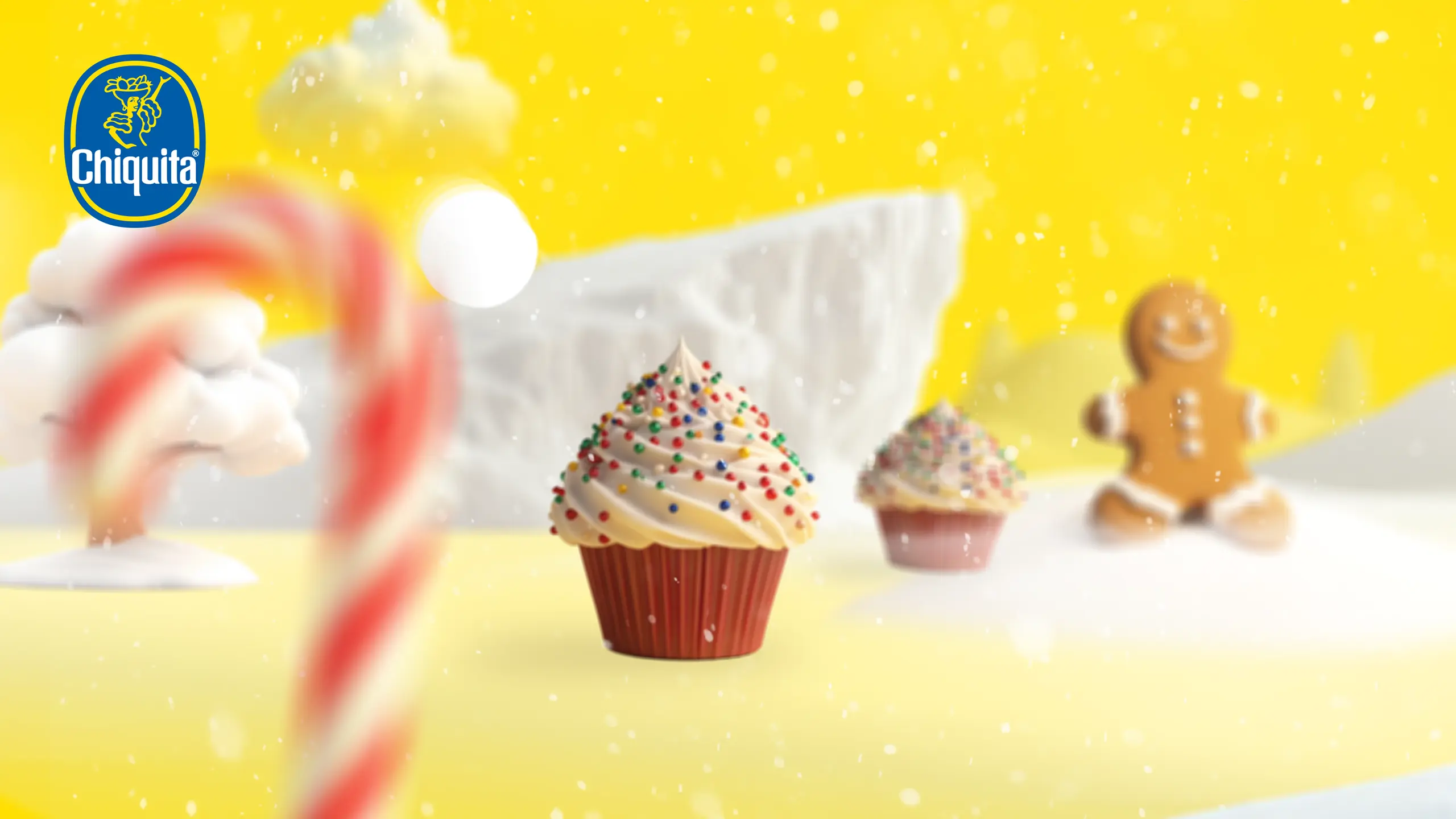 KI-generierte Weihnachtswelt mit Cupcake und Lebkuchenfigur aus dem Chiquita Weihnachtsfilm